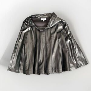 Adina pleated faux leather skirt featuring a high-waisted, flared design.